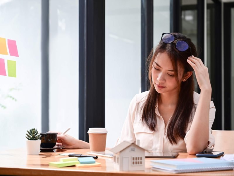 real-estate-agent-working-with-digital-tablet-at-her-office-.jpg